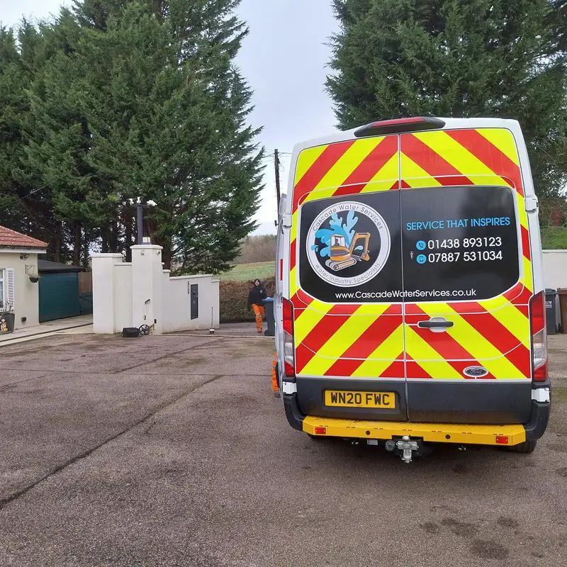 Cascade Water Services van with rear chevron livery parked on site